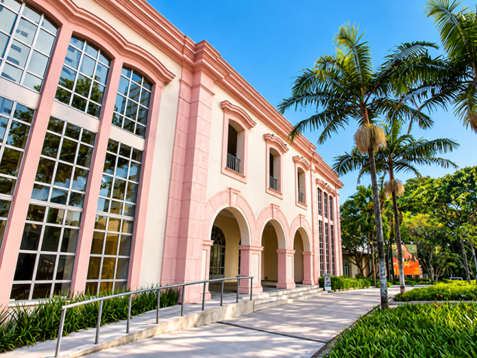 Neoclassical Pink Facade Under Palm Trees